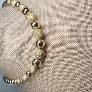 Gold Tone Graduated Smooth and Textured Bead Necklace